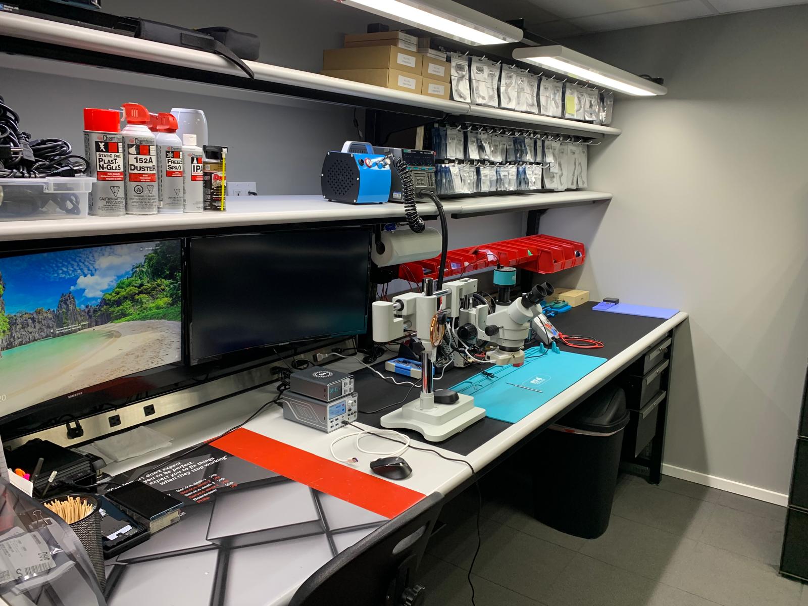 Professional electronics repair technician at work